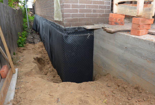 Happy homeowners after waterproofing job in Elnora